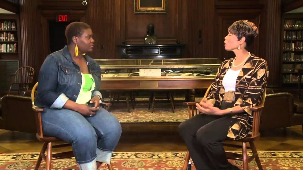 Young woman interviewing Rev. Dr. Yolanda Smith