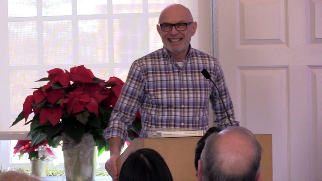 Miroslav Volf standing at the lecturn