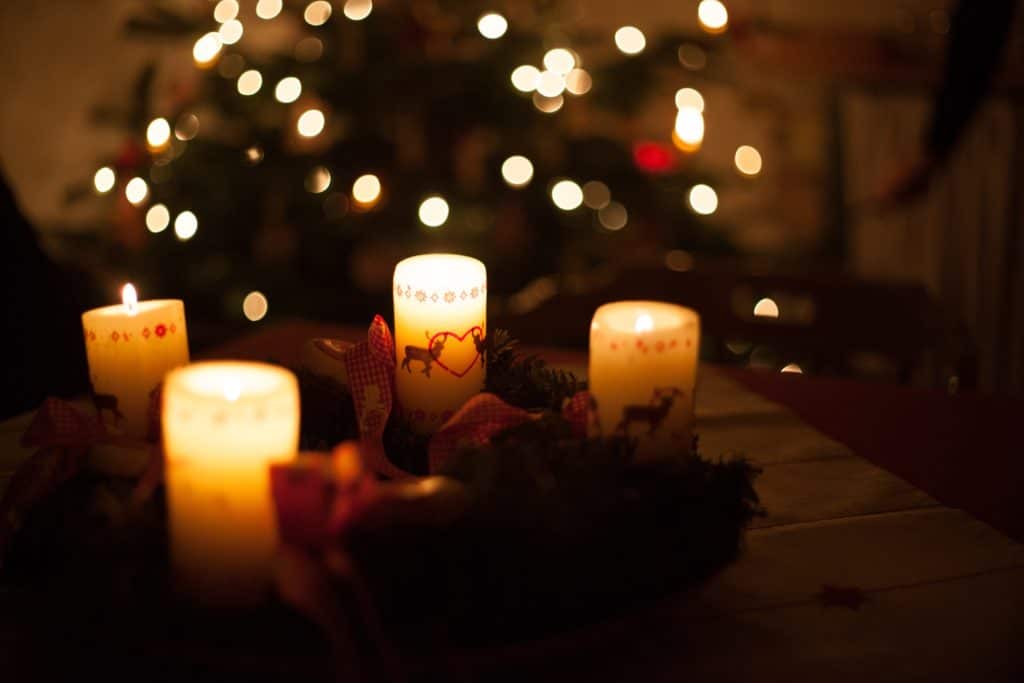 white candles on brown wooden table